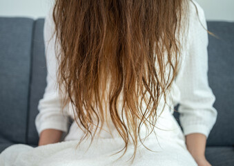 Cropped shot view of women's hair damaged. Hair damage is risk for further damage and breakage. It may also look dull or frizzy and be difficult to manage.