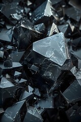 A close-up of a dark, angular crystal with a mesmerizing texture.
