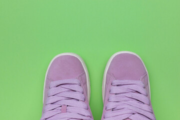 Stylish Pink Sneakers on Green Background