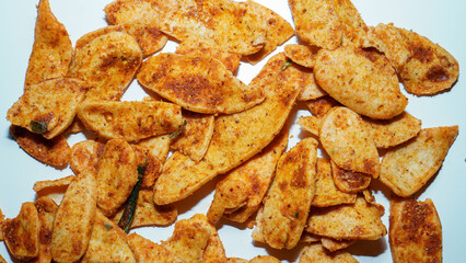 Basreng or fried meatballs, a snack of sliced ​​and fried meatballs sprinkled with spicy spices, isolated on a white background, full view of basreng frem.