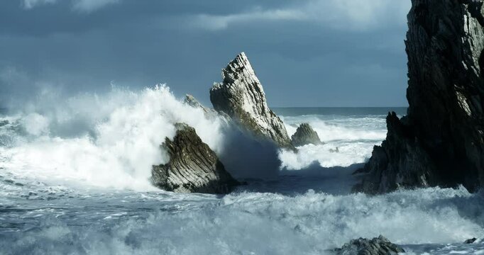 Heavy Waves Crashing in slowmotion on the white rock at new zealands coast