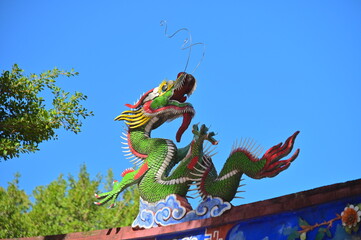 Close-up of the intricate dragon mosaic on the roof ridge of Taipei Confucius Temple, showcasing...