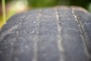 A close up of a tire with a black stripe