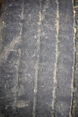 A tire with a black and brown surface.