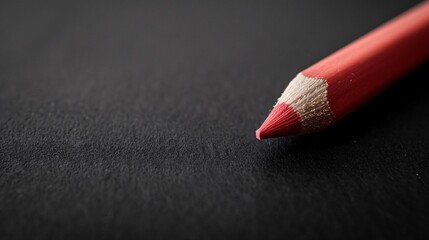 07231249 251. Close-up of a pencil eraser on a black paper background, with soft focus and low-key lighting, emphasizing the simplicity and sophistication of the business and education concept