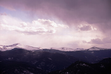 snowstorm coming in over the distant mountains