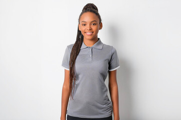 A portrait of a Black woman wearing a gray polo shirt.