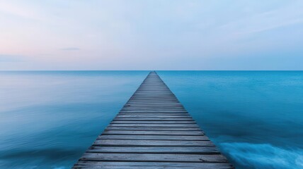 Obraz premium A long wooden pier stretching out over the calm