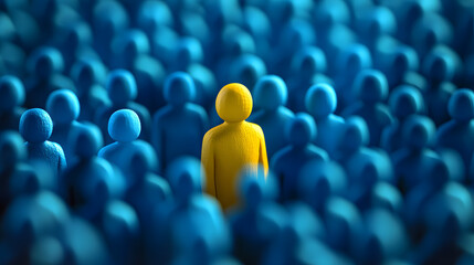 Fototapeta premium A single yellow figure stands out among a crowd of blue figures.