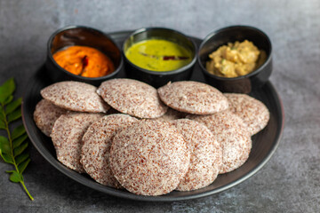 Selective focus of Soft, steamed Idli made from fermented ragi flour, rich in nutrients, perfect for a healthy breakfast.