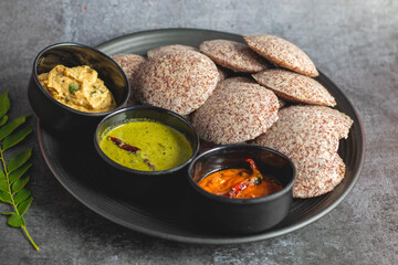 Selective focus of Soft, steamed Idli made from fermented ragi flour, rich in nutrients, perfect for a healthy breakfast.