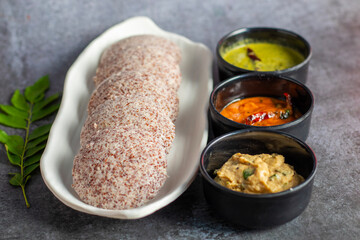 Selective focus of Soft, steamed Idli made from fermented ragi flour, rich in nutrients, perfect...