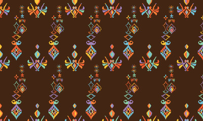 Ikat seamless pattern,geometric design,motif ethnic handmade, Ikat ethnic tribal,boho colors seamless wallpaper. for background,fabric,wrapping,clothing,wallpaper,Batik,carpet,embroidery style.