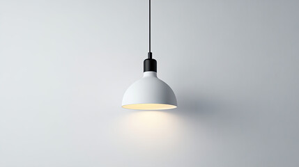 Modern pendant lamp hanging against a minimalist wall, casting a warm glow for stylish interior lighting.