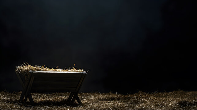 An empty manger with a nativity scene concept