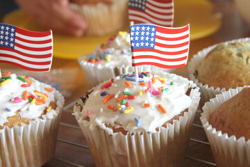 USA American White Cupcakes with Colorful Confetti Sprinkles and Miniature Flag Patriotic Cupcake Toppers