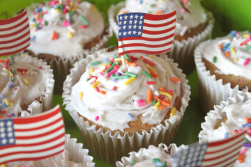 USA American White Cupcakes with Colorful Confetti Sprinkles and Miniature Flag Patriotic Cupcake Toppers