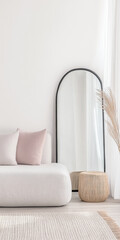 Minimalist interior design composition in neutral colors with a mirror next to a large window, a rug and a sofa.