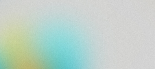Obraz premium Grainy textured abstract background with a soft pastel gradient from blue to yellow