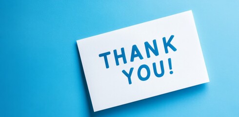 "Thank You" Text on White Paper Cutout Against Blue Background, Minimalist Style with Copy Space