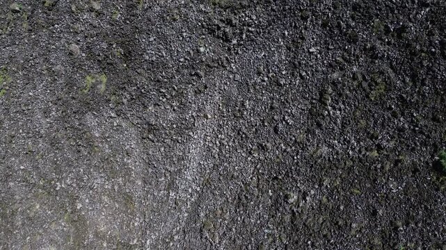 Stories of the Ceboruco volcano cover the black magma road with frozen rocks.