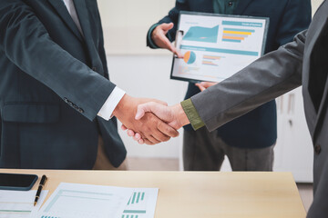 A lawyer meets with clients in a professional office, offering expert legal consultation and representation. Specializing in business planning, they operate within private firms or as freelance