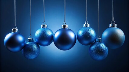 Obraz premium Blue christmas balls hanging on string against dark blue background