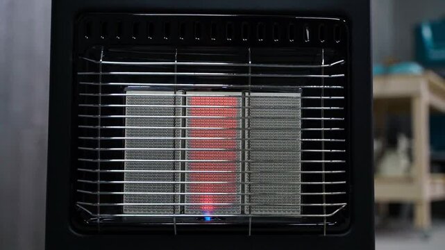 The camera smoothly zooms in on a working gas portable heater