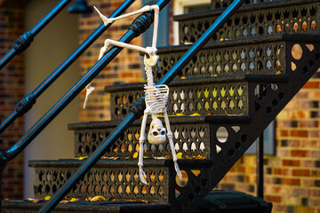 Thanksgiving holidays. Halloween decorations. Halloween pumpkin and skeleton for decorated house. Scary Decorated at front yard of a American home. Trick or treat. Halloween background.