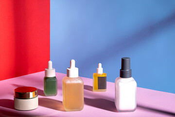 Group of beauty products in a studio shot  with colorful fashion setup