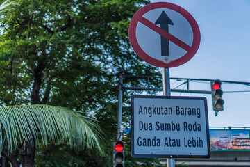 close-up of Indonesian language traffic signs, signs for more than two wheels are prohibited from...