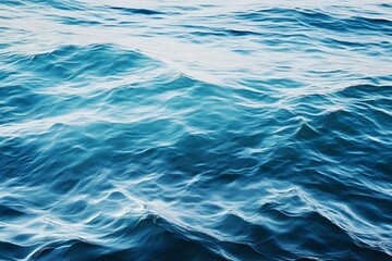 Fototapeta premium Rippling water texture, capturing the fluidity and movement of gentle waves, perfect for serene backgrounds