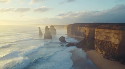 Twelve Apostles: The dramatic limestone stacks of the Twelve Apostles along the Great Ocean Road, with waves crashing below.
