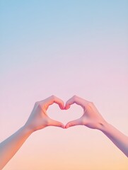 Fototapeta premium A pair of hands forming a heart shape against a serene pastel backdrop, symbolizing love and kindness 