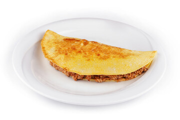 Delicious omelette filled with minced meat lying on a plate