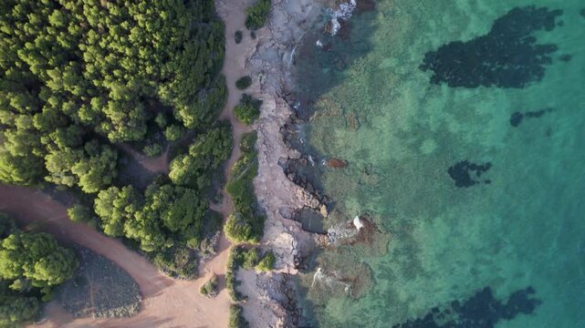 An aerial drone view of the Mediterranean coastline featuring turquoise waters in Oropesa del Mar. High-quality 4K footage.