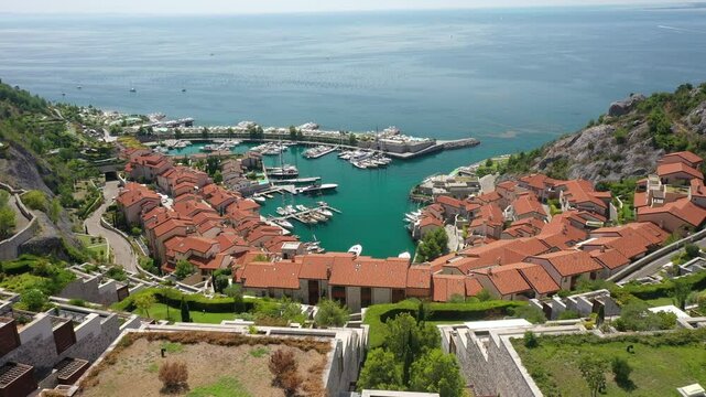 Summer Video of Porto Piccolo Near Trieste. Portopiccolo Sistiana, a luxury resort nestled in a beautiful cove along the Adriatic Sea, Italy. Panoramic view of elegant coastal retreats and stunning wa