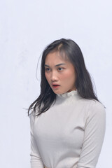 Obraz premium Young Asian Woman Poses and Face Expressions