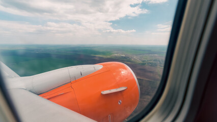 view from the airplane window of the airport during takeoff