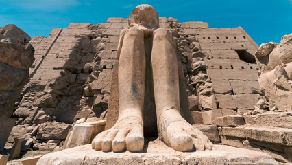 antique statue in the pillared hall in Luxor in Egypt
