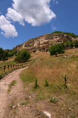 Naklejka premium Mountain landscape with white clouds