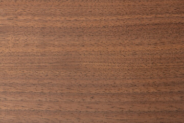 Black walnut board texture. Pink crystals of natural food Himalayan coarse salt texture or background, close-up, high resolution.
