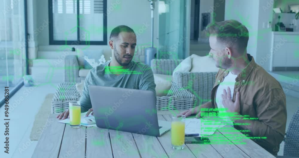 Poster green digital data animation over two men working on laptops at table