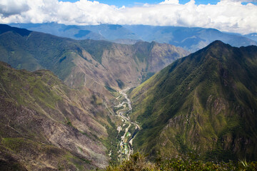 River running along a valley as seen from Machu Picchu mountain in Peru
