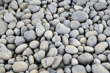 beautiful background of stones at the beach nearby the site Lóndrangar in Snaefellsnes, Western Iceland