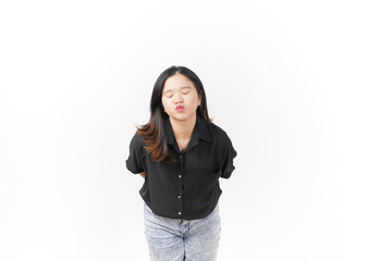 Obraz premium Young Asian woman blowing kiss wearing Black t-shirt and jeans isolated on white background