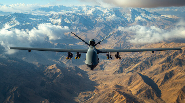 Military drone flying over mountainous region