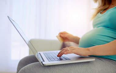Naklejka premium Pregnant woman, hands and credit card with laptop in home for maternity online shopping and financial payment on sofa. Ecommerce, person and web purchase with transaction, banking service or consumer
