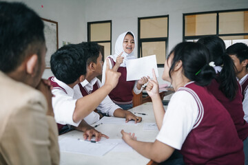 Young Asian Muslim Female Students Presenting Her Task In Front Of Classmates