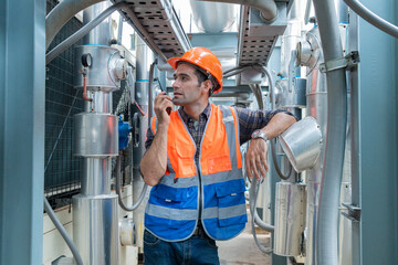 Engineers check and adjust the valves to ensure the proper amount of water flows into the air conditioning pipes.